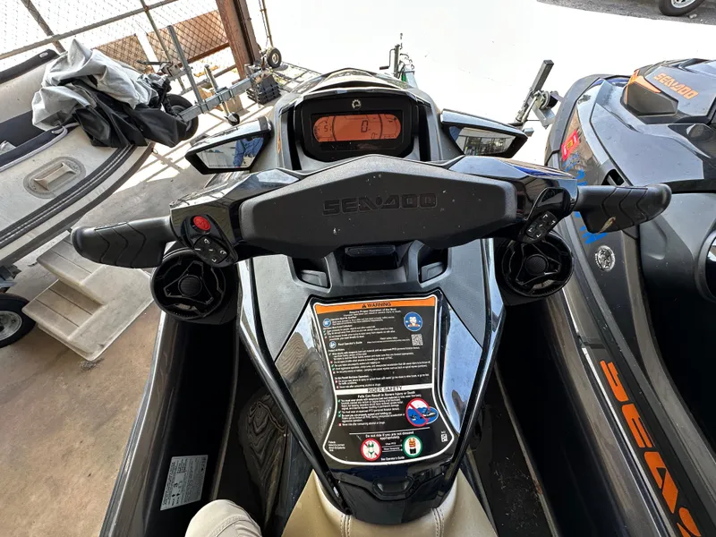 Slide: The Image of 2023 Sea-Doo GTX 230 dashboard and handlebars in a storage area. - 4