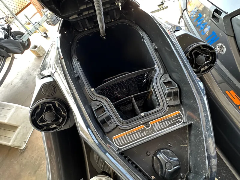 Slide: The Image of Open storage compartment of 2023 Sea-Doo GTX 230 watercraft, showcasing interior space. - 5