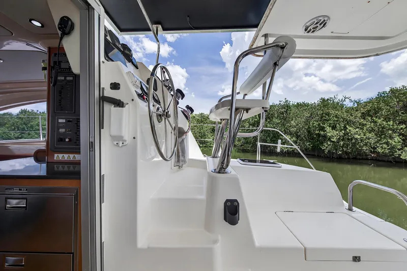 Slide: The Image of Helm station of 2011 Leopard 38 yacht with steering wheel and seating. - 21