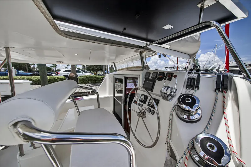 Slide: The Image of Helm of 2011 Leopard 38 catamaran with steering wheel and navigation controls. - 24