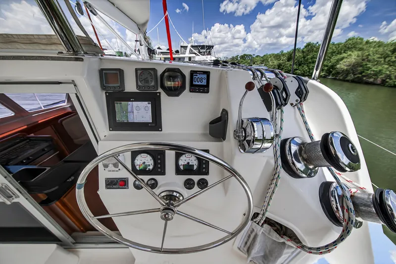 Slide: The Image of Helm of 2011 Leopard 38 catamaran with navigation instruments and steering wheel. - 25