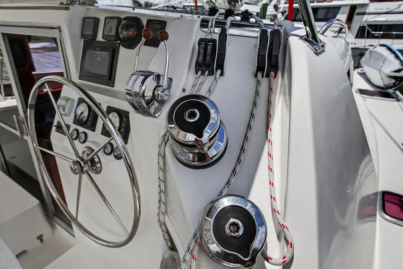 Slide: The Image of Steering and control panel of 2011 Leopard 38 catamaran with ropes and winches. - 28