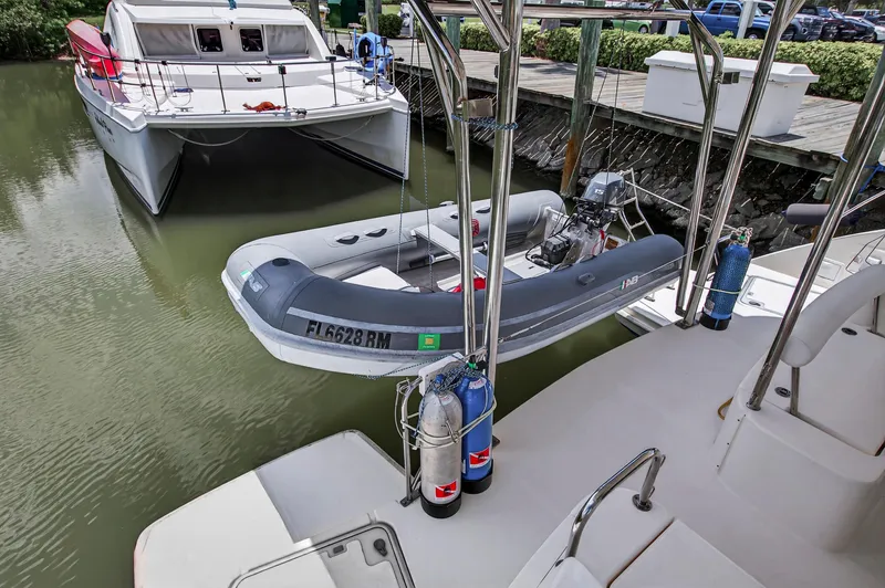 Slide: The Image of 2011 Leopard 38 catamaran docked with inflatable dinghy and safety equipment. - 29