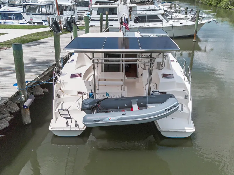 Slide: The Image of 2011 Leopard 38 catamaran docked with solar panels and inflatable dinghy. - 3