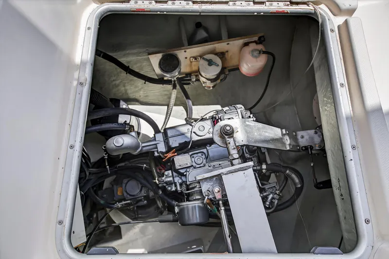 Slide: The Image of Engine compartment of a 2011 Leopard 38 catamaran, showcasing mechanical components and systems. - 30