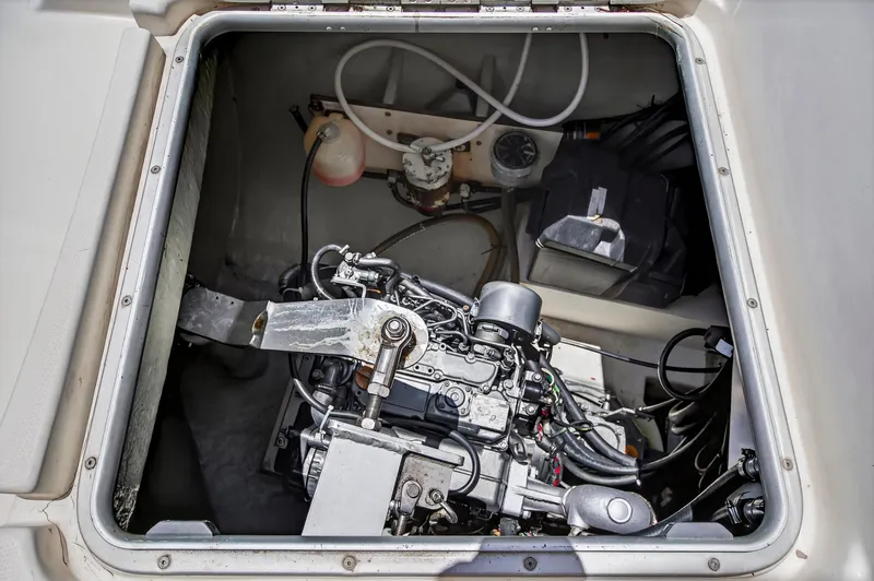 Slide: The Image of Engine compartment of a 2011 Leopard 38 catamaran, showcasing mechanical components and wiring. - 32