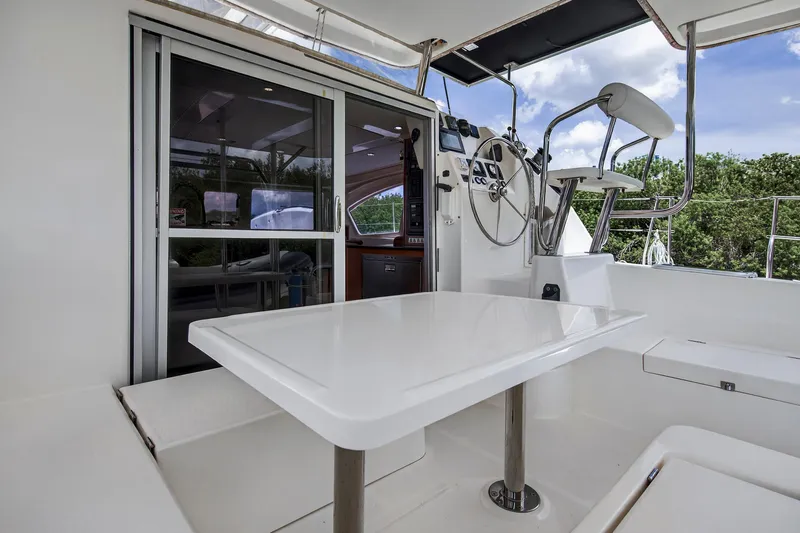 Slide: The Image of 2011 Leopard 38 yacht cockpit with steering wheel and seating area. - 37