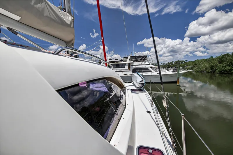 Slide: The Image of Sailing yacht Leopard 38, 2011 model, docked on a sunny day with blue skies. - 39