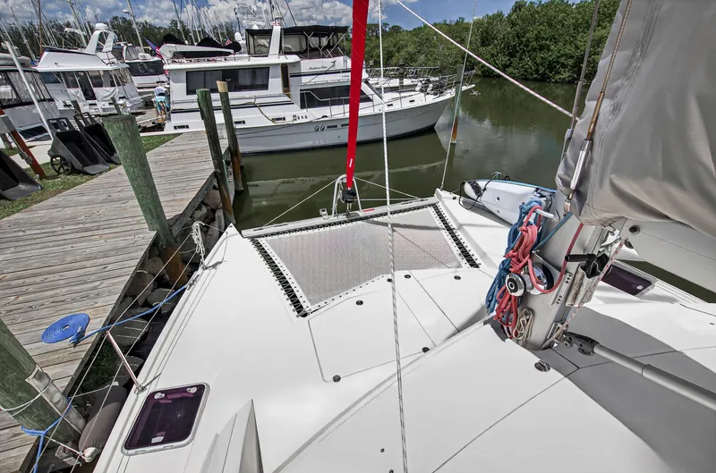 Slide: The Image of Leopard 38 catamaran docked at marina, showcasing deck and rigging, 2011 model. - 55