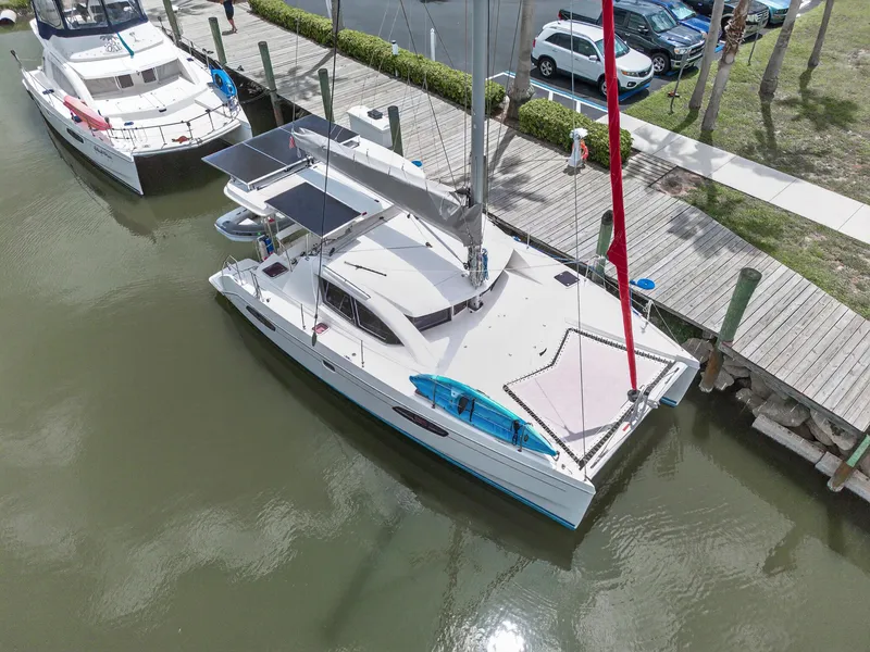 Slide: The Image of Aerial view of a 2011 Leopard 38 catamaran docked at a marina. - 9
