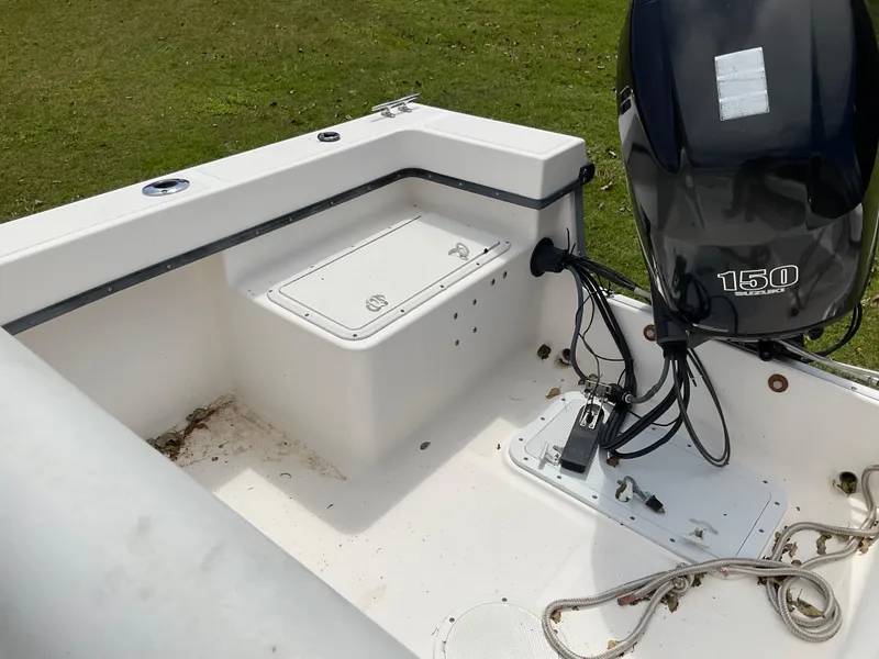 Slide: The Image of 2007 May-Craft 2000CC boat with Suzuki 150 engine, grassy background. - 10