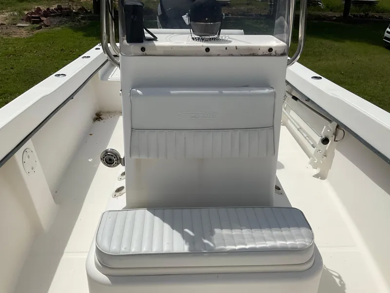 Slide: The Image of 2007 May-Craft 2000CC boat interior with white seating and console. - 13