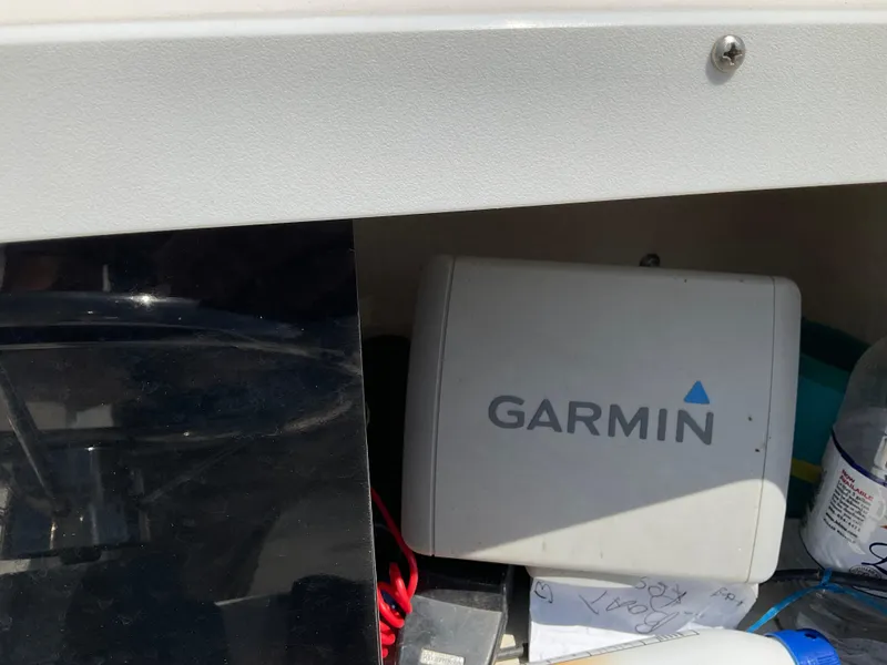 Slide: The Image of Garmin device inside a 2007 May-Craft 2000CC boat compartment. - 19