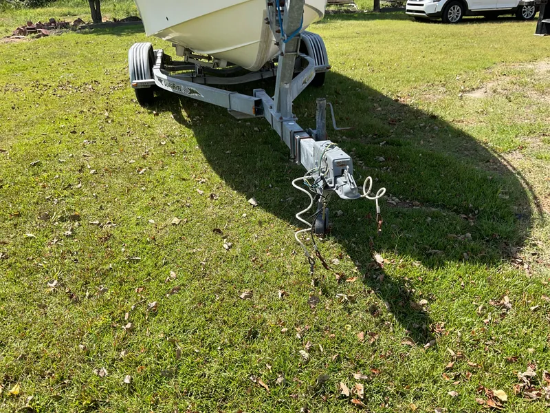 Slide: The Image of 2007 May-Craft 2000CC boat on trailer, parked on grassy area. - 23