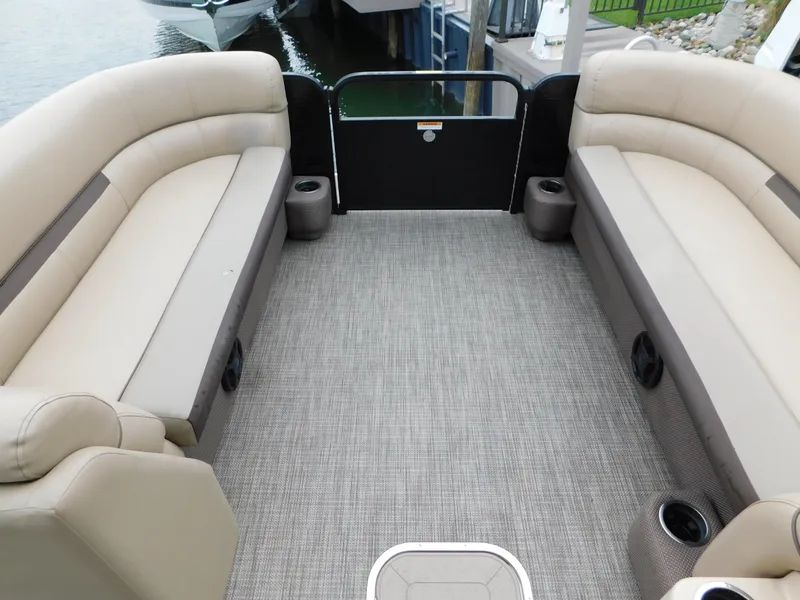 Slide: The Image of 2019 Godfrey SWEETWATER 2186 SB pontoon boat interior with beige seating and gray flooring. - 19