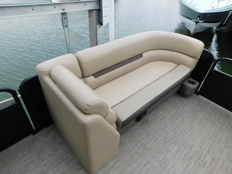 Slide: The Image of Beige seating on 2019 Godfrey SWEETWATER 2186 SB pontoon boat, docked by water. - 20