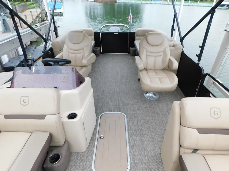 Slide: The Image of 2019 Godfrey SWEETWATER 2186 SB pontoon boat interior with beige seating and helm. - 23