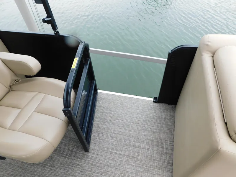 Slide: The Image of 2019 Godfrey SWEETWATER 2186 SB boat interior with beige seating and water view. - 26