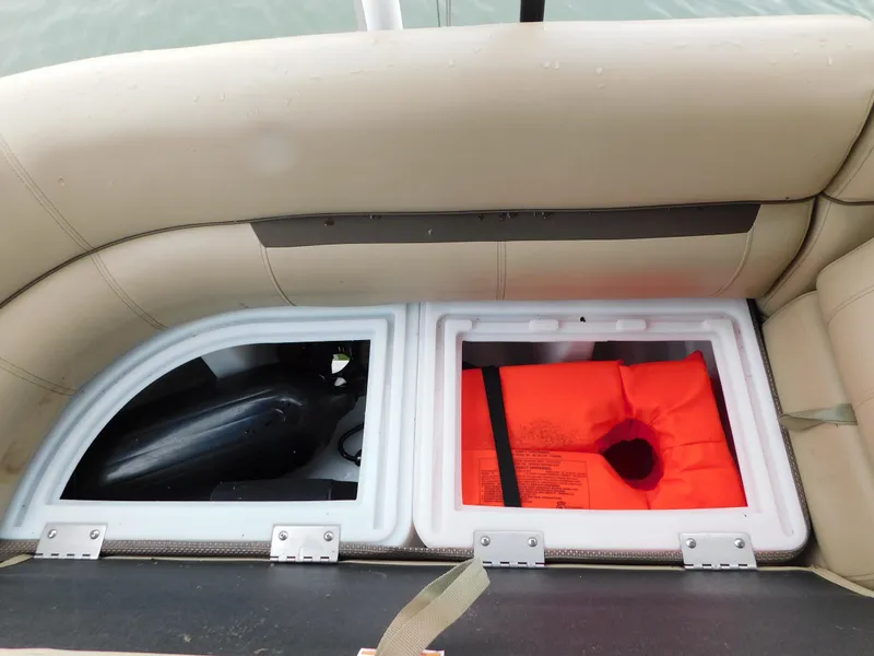 Slide: The Image of Storage compartments on 2019 Godfrey SWEETWATER 2186 SB boat with life jacket. - 34