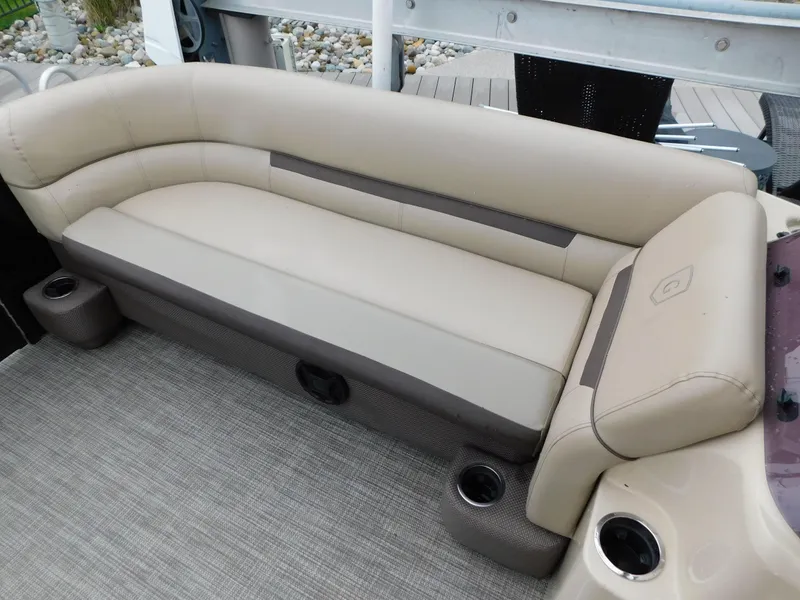 Slide: The Image of 2019 Godfrey SWEETWATER 2186 SB boat seating with beige upholstery and integrated cup holders. - 36