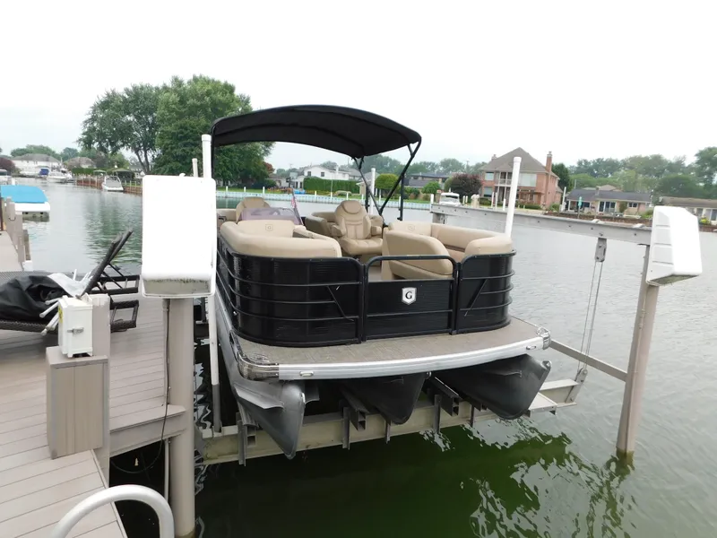 Slide: The Image of 2019 Godfrey SWEETWATER 2186 SB pontoon boat docked on a lift. - 4