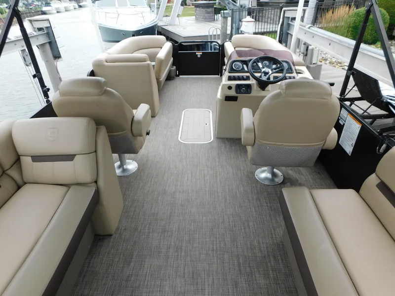 Slide: The Image of 2019 Godfrey SWEETWATER 2186 SB pontoon boat interior with beige seating and steering console. - 6