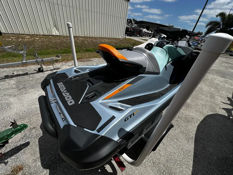 Slide: The Image of 2023 Sea-Doo GTI SE 170 jet ski parked outdoors on a sunny day. - 12