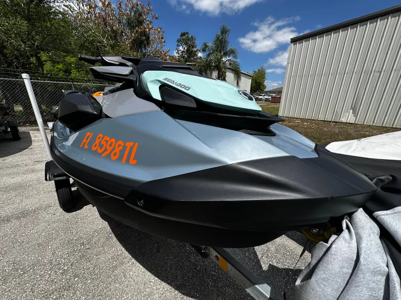Slide: The Image of 2023 Sea-Doo GTI SE 170 jet ski parked outdoors on a sunny day. - 15