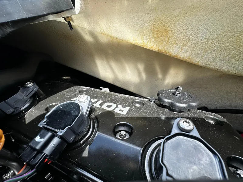 Slide: The Image of Close-up of 2023 Sea-Doo GTI SE 170 engine components under sunlight. - 24