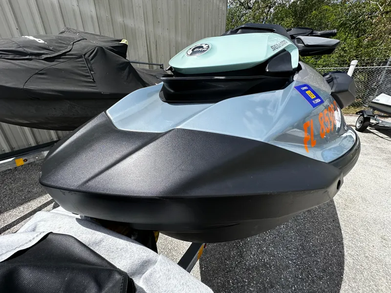 Slide: The Image of 2023 Sea-Doo GTI SE 170 jet ski parked outdoors, showcasing sleek design and vibrant colors. - 4