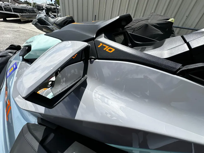 Slide: The Image of 2023 Sea-Doo GTI SE 170 jet ski close-up with side mirror and sleek design. - 7