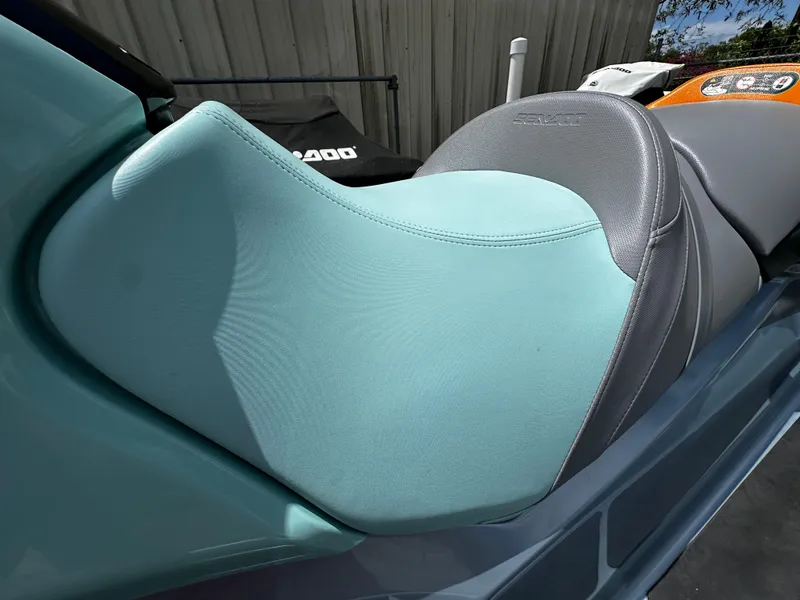 Slide: The Image of 2023 Sea-Doo GTI SE 170 seat, teal and gray design, close-up view. - 9