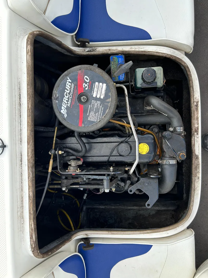 Slide: The Image of 2003 Bayliner 175 Bowrider engine compartment with Mercury 3.0 motor visible. - 9