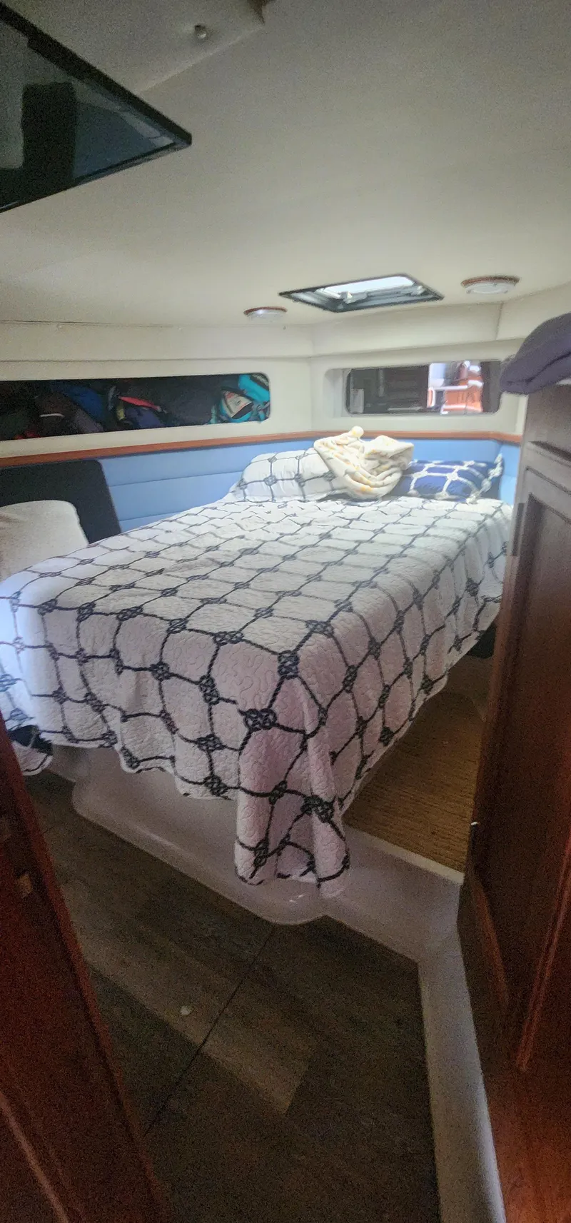 Slide: The Image of Cozy bedroom in 1990 Carver 38 Santego yacht with nautical-themed bedding. - 34