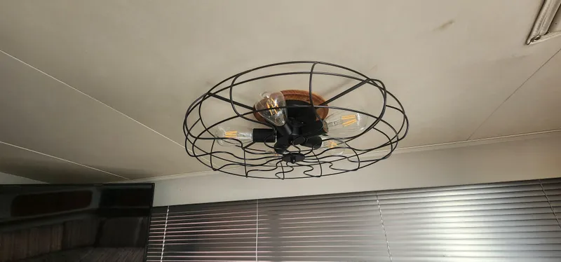 Slide: The Image of Ceiling light fixture with wire cage design in 1990 Carver 38 Santego interior. - 35