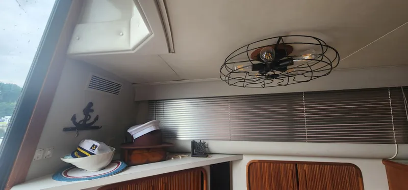 Slide: The Image of Interior of 1990 Carver 38 Santego yacht with nautical decor and hats. - 36