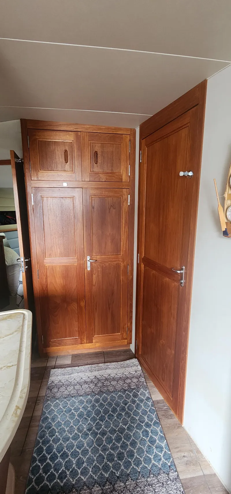 Slide: The Image of Interior of 1990 Carver 38 Santego with wooden cabinets and doors. - 24