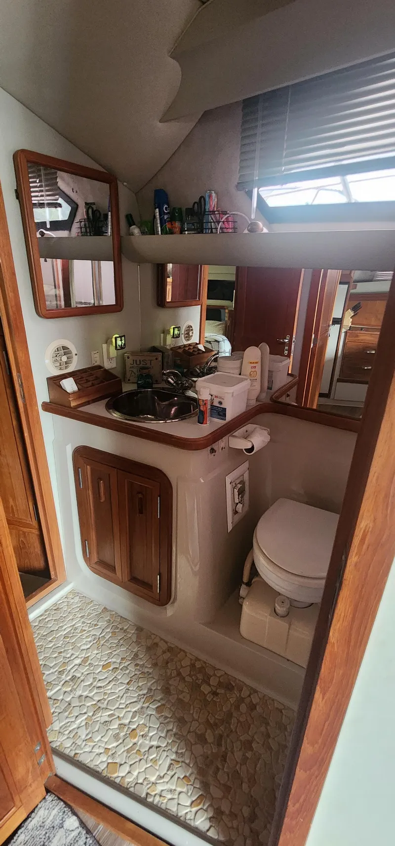 Slide: The Image of Bathroom interior of 1990 Carver 38 Santego yacht with sink and toilet. - 25