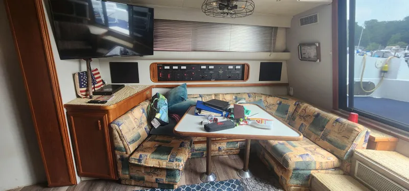 Slide: The Image of Interior of 1990 Carver 38 Santego yacht with cozy seating and modern amenities. - 28