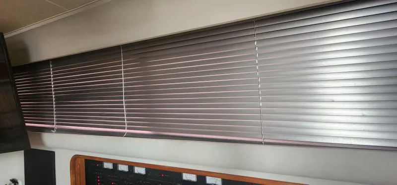 Slide: The Image of Interior of 1990 Carver 38 Santego yacht with closed horizontal blinds. - 37