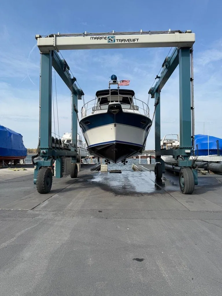 Slide: The Image of 1990 Carver 38 Santego yacht on a Marine Travelift at a boatyard. - 39