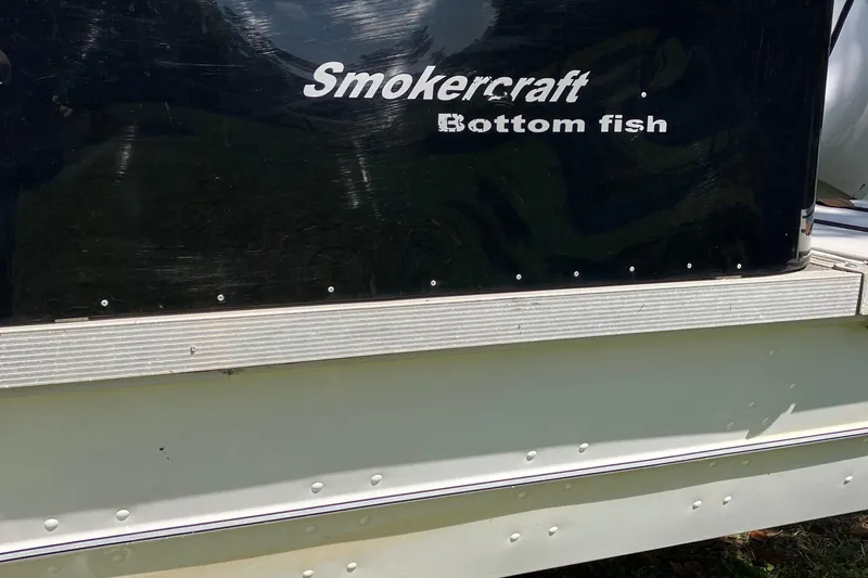 Slide: The Image of 1996 Smoker Craft 820 boat with "Bottom fish" label on the side. - 3