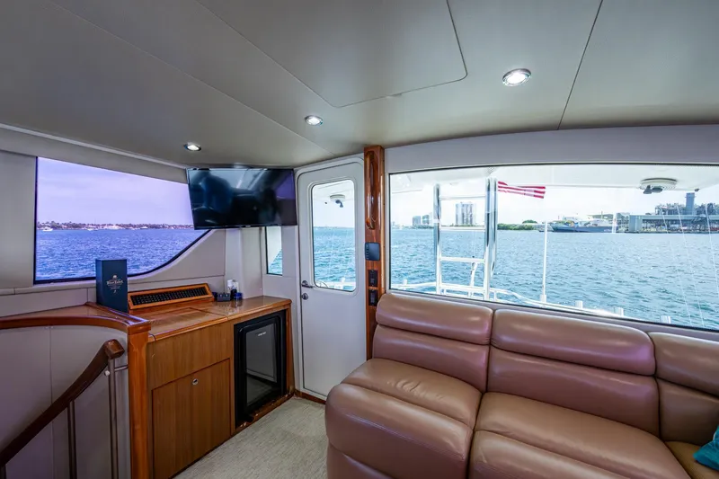 Slide: The Image of Luxurious interior of 2005 Viking 61 yacht with leather seating and ocean view. - 13