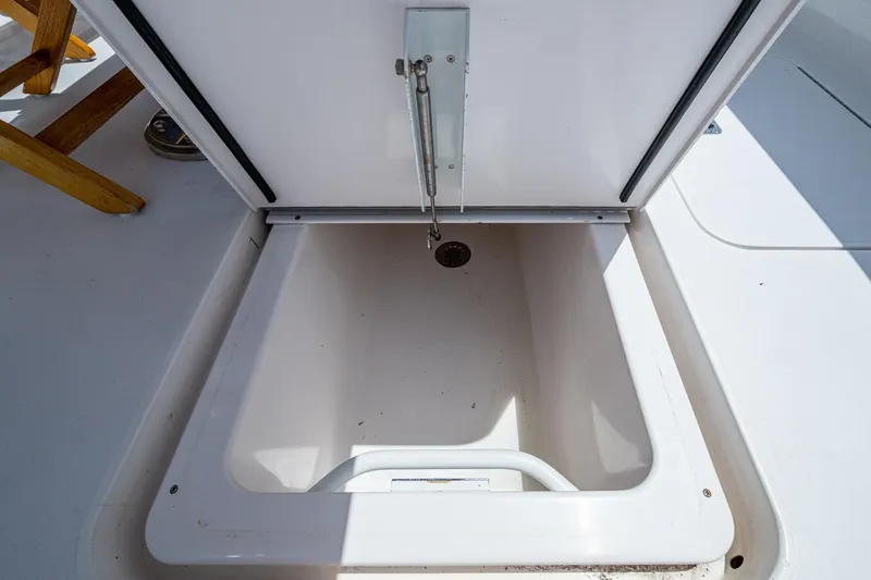 Slide: The Image of Open storage compartment on 2005 Viking 61 yacht deck. - 27