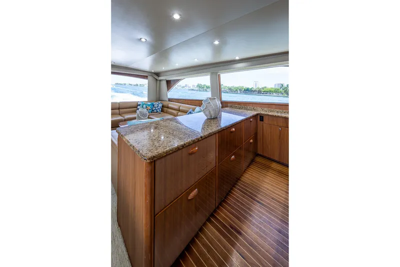 Slide: The Image of Luxurious interior of 2005 Viking 61 yacht with elegant wood cabinetry and granite countertops. - 41