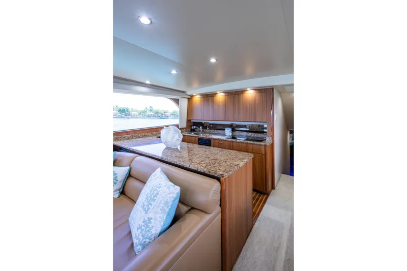 Slide: The Image of Luxurious interior of 2005 Viking 61 yacht with elegant wood and granite finishes. - 44