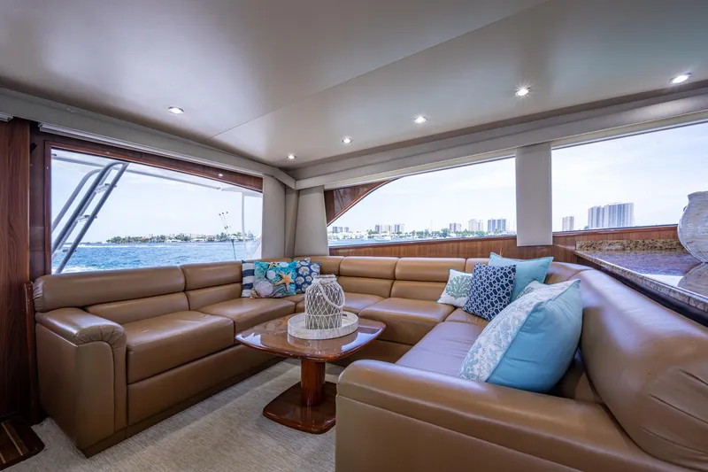 Slide: The Image of Luxurious interior of 2005 Viking 61 yacht with leather seating and ocean view. - 52