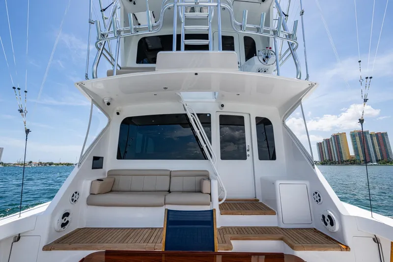 Slide: The Image of 2005 Viking 61 yacht with spacious deck, comfortable seating, and ocean view. - 61