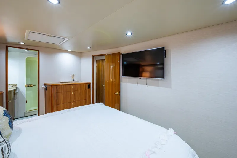 Slide: The Image of Luxurious cabin interior of 2005 Viking 61 yacht with TV and wooden furnishings. - 67