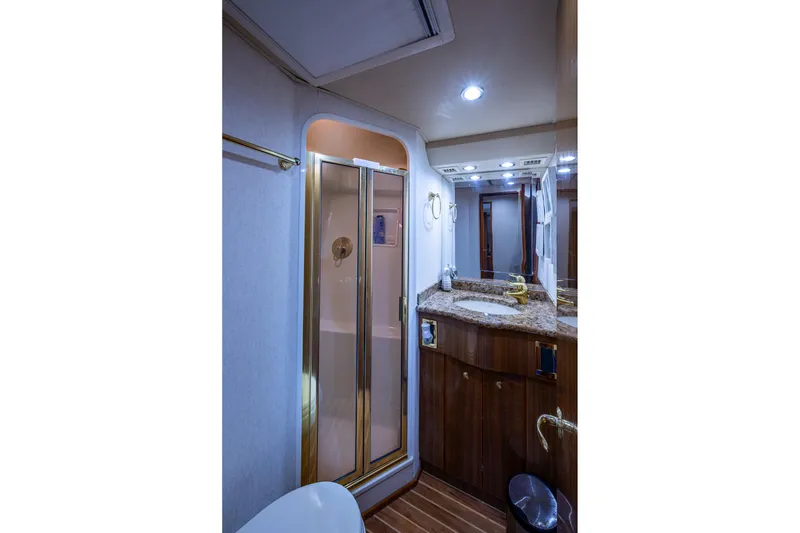 Slide: The Image of Luxurious bathroom in 2005 Viking 61 yacht with granite countertop and enclosed shower. - 68
